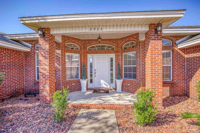 doorway to property with a porch