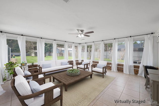 sunroom with ceiling fan and a healthy amount of sunlight