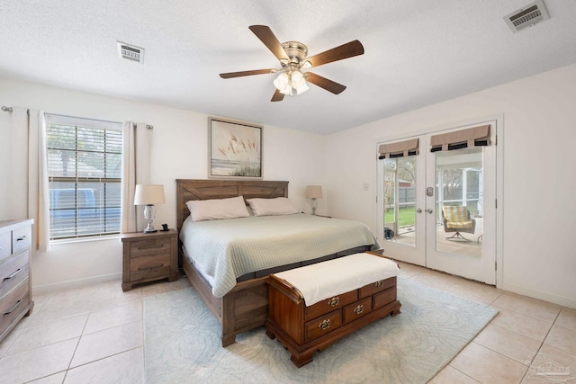 bedroom with light tile patterned floors, access to outside, french doors, and visible vents