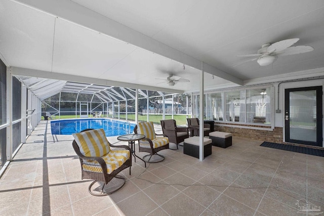 pool featuring ceiling fan, a patio, and a lanai