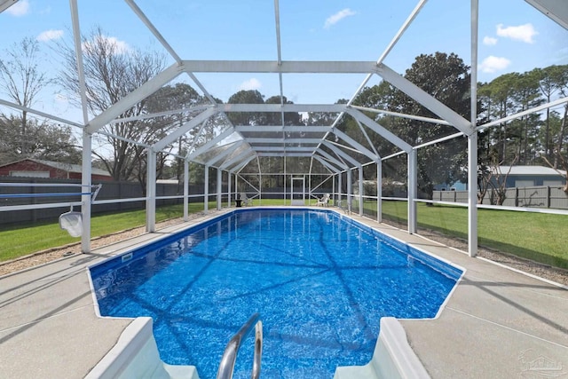 view of swimming pool with a patio, a fenced backyard, a lanai, a yard, and a fenced in pool