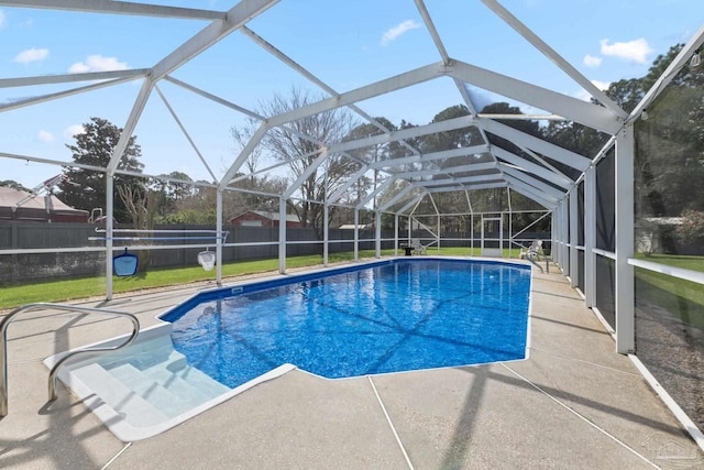 view of pool with a fenced in pool, a yard, a patio, a lanai, and a fenced backyard