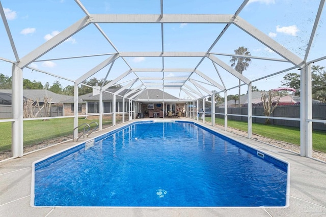 view of pool with a fenced in pool, a fenced backyard, a lanai, a yard, and a patio area