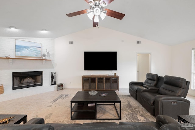 living area featuring a ceiling fan, visible vents, vaulted ceiling, and a fireplace