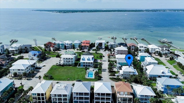 birds eye view of property with a residential view and a water view