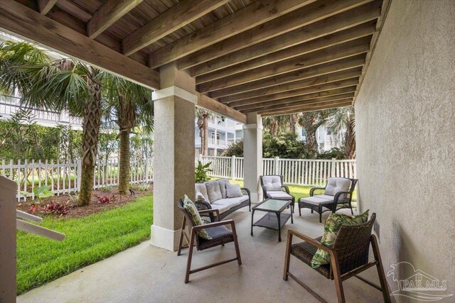 view of patio / terrace with an outdoor living space and a fenced backyard