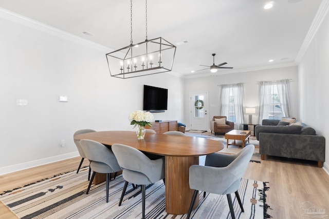 dining room featuring ceiling fan, recessed lighting, baseboards, light wood finished floors, and crown molding