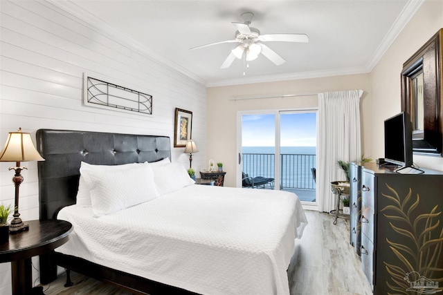 401 E Beach Blvd Unit 1207, Gulf Shores, AL 36542 - bedroom featuring access to exterior, wood finished floors, ornamental molding, a ceiling fan, and wood walls