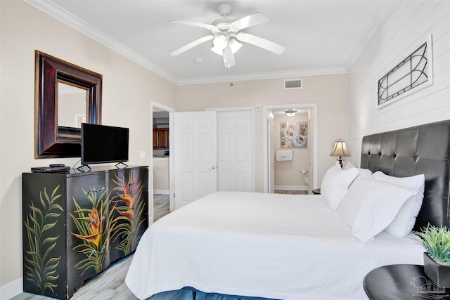401 E Beach Blvd Unit 1207, Gulf Shores, AL 36542 - bedroom with ornamental molding, ensuite bath, a ceiling fan, and baseboards