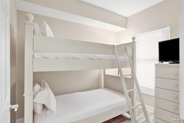 401 E Beach Blvd Unit 1207, Gulf Shores, AL 36542 - bedroom featuring wood finished floors and baseboards