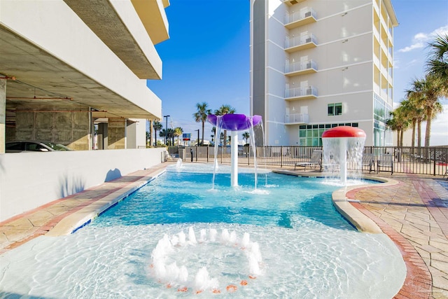 401 E Beach Blvd Unit 1207, Gulf Shores, AL 36542 - community pool featuring a patio