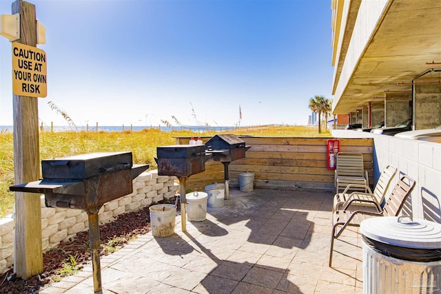 401 E Beach Blvd Unit 1207, Gulf Shores, AL 36542 - view of patio featuring a water view