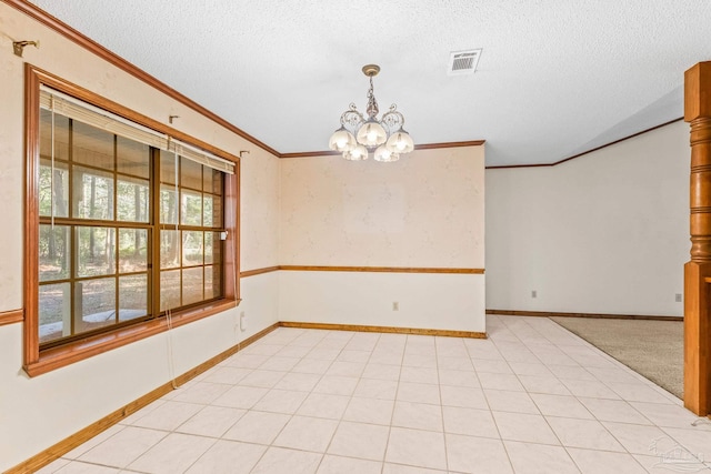 carpeted empty room with crown molding, a notable chandelier, and a textured ceiling