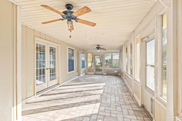 unfurnished sunroom featuring french doors