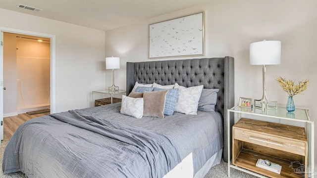 bedroom with hardwood / wood-style floors