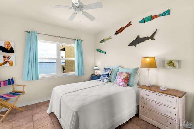 tiled bedroom with ceiling fan