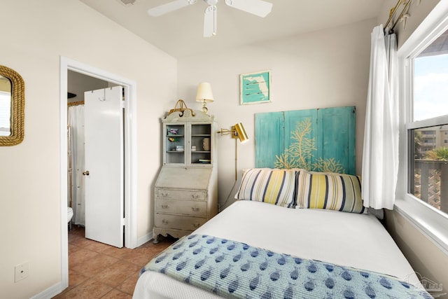 tiled bedroom with ceiling fan