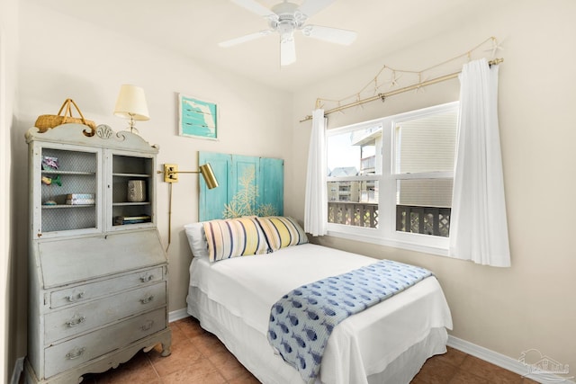 tiled bedroom featuring ceiling fan