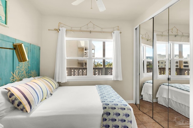 bedroom featuring ceiling fan and tile patterned floors