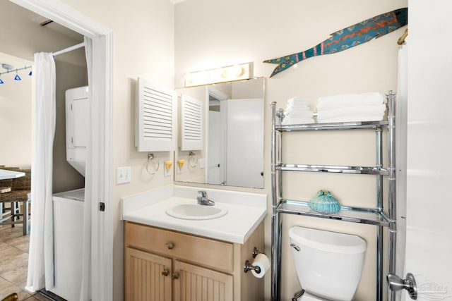 bathroom featuring toilet, vanity, and tile patterned flooring