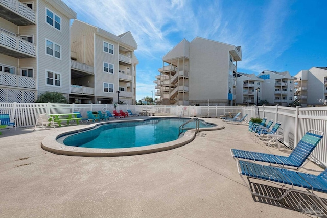 view of swimming pool with a patio area