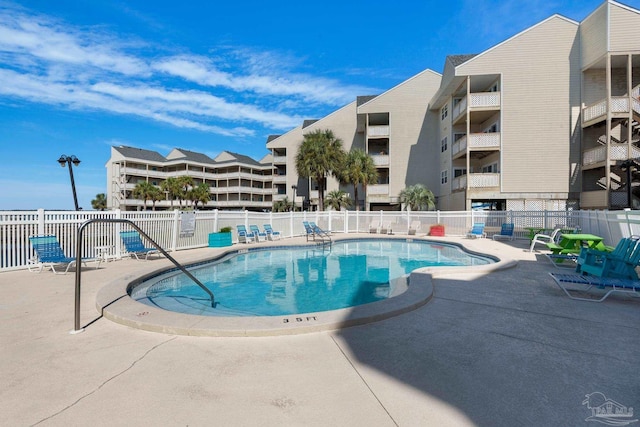 view of swimming pool featuring a patio area