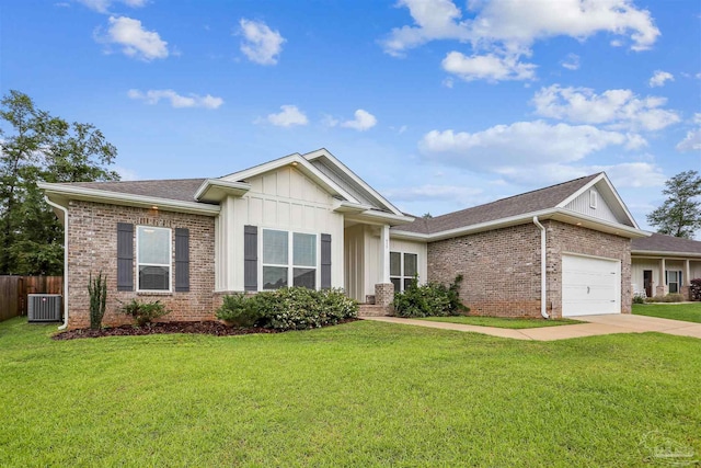 415 Broadleaf Cir, Cantonment, FL 32533 - ranch-style home featuring brick siding, central air condition unit, a garage, and driveway