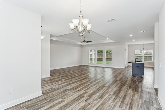 415 Broadleaf Cir, Cantonment, FL 32533 - unfurnished living room with a chandelier, wood finished floors, baseboards, recessed lighting, and a sink