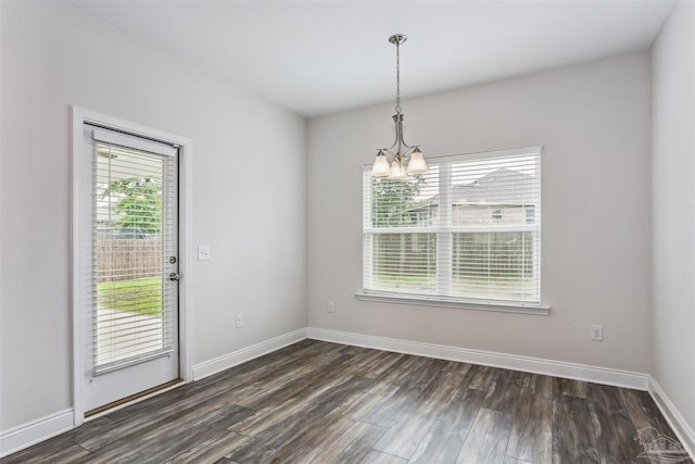 415 Broadleaf Cir, Cantonment, FL 32533 - unfurnished dining area with a chandelier, dark wood-style floors, and baseboards