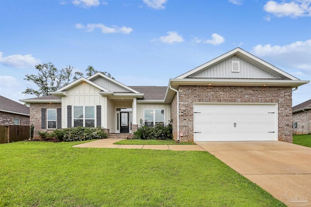 415 Broadleaf Cir, Cantonment, FL 32533 - view of front of house featuring brick siding, board and batten siding, driveway, and an attached garage