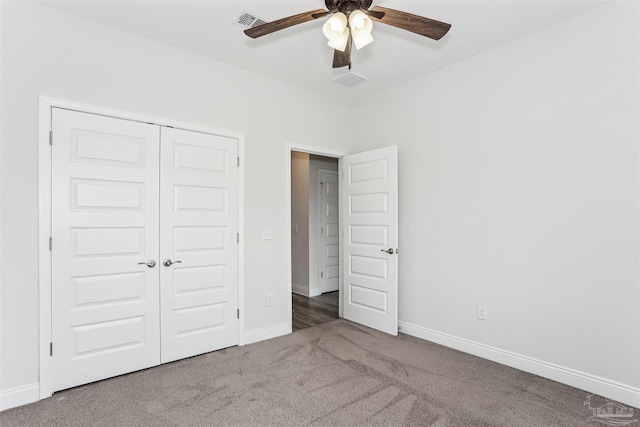 415 Broadleaf Cir, Cantonment, FL 32533 - unfurnished bedroom featuring carpet floors, a closet, baseboards, and a ceiling fan