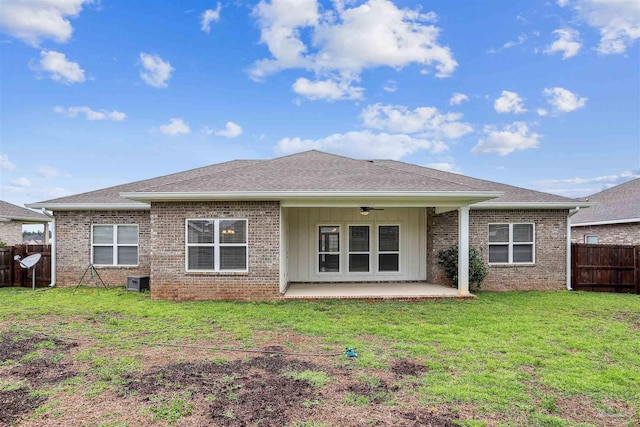 415 Broadleaf Cir, Cantonment, FL 32533 - rear view of house featuring ceiling fan, brick siding, a patio, a shingled roof, and board and batten siding