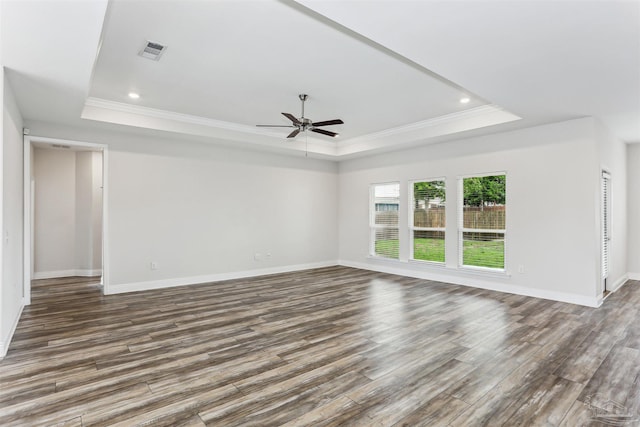 415 Broadleaf Cir, Cantonment, FL 32533 - empty room featuring a tray ceiling, crown molding, a ceiling fan, wood finished floors, and baseboards