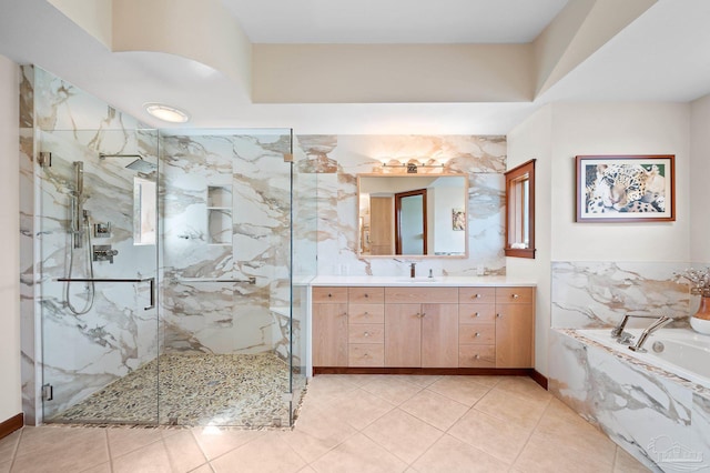 bathroom with vanity, shower with separate bathtub, and tile patterned floors