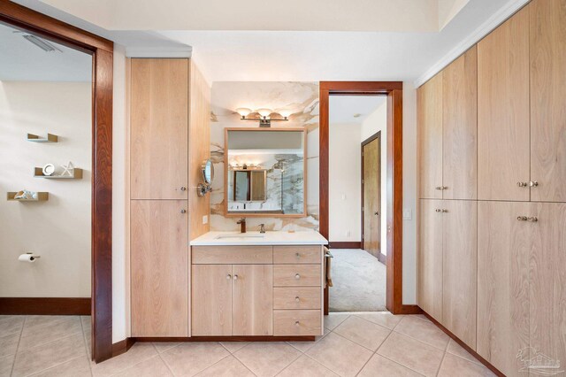 bathroom featuring tile patterned floors and vanity