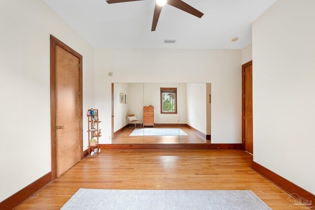 spare room with ceiling fan and light hardwood / wood-style flooring