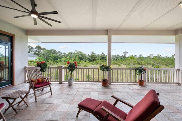 view of patio / terrace featuring a balcony and ceiling fan