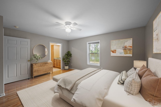 20033 Erin Pond, Seminole, AL 36574 - bedroom with baseboards, a ceiling fan, light wood finished floors, and ensuite bath