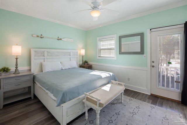 bedroom with dark hardwood / wood-style floors and crown molding