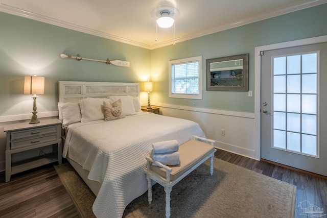 bedroom with ornamental molding, dark hardwood / wood-style floors, and ceiling fan