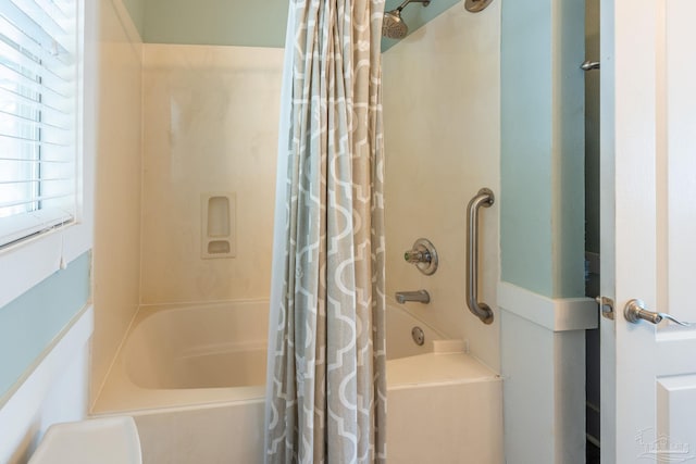 bathroom featuring shower / bath combo with shower curtain