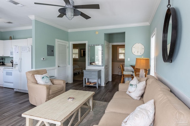 living room with crown molding, dark wood-type flooring, ceiling fan, and electric panel