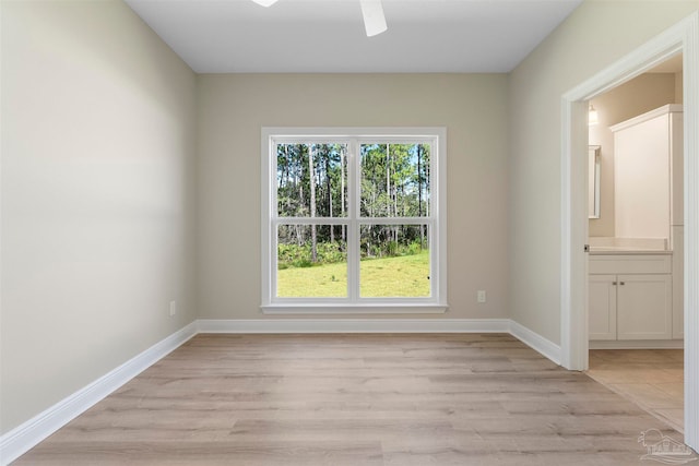 unfurnished room with ceiling fan and light hardwood / wood-style flooring