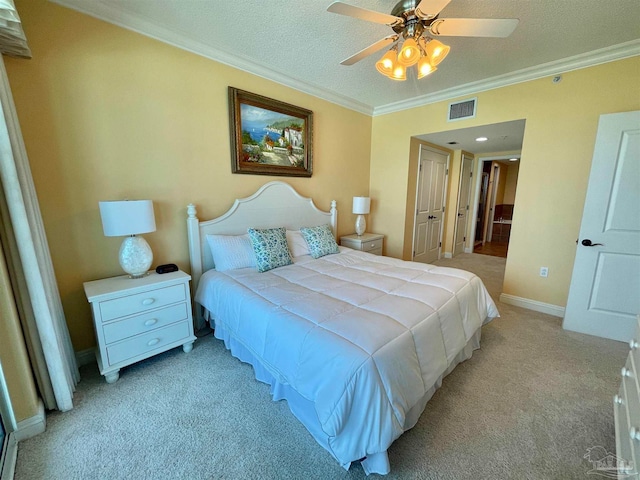 bedroom with crown molding, light carpet, ceiling fan, and a textured ceiling