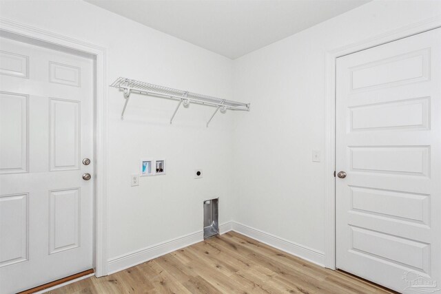 laundry room with washer hookup, light hardwood / wood-style floors, and hookup for an electric dryer