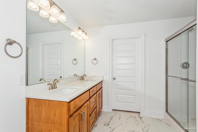 bathroom with vanity and an enclosed shower