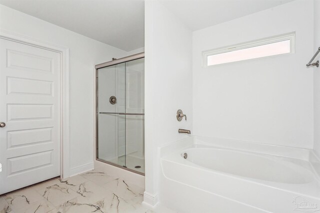 bathroom with separate shower and tub