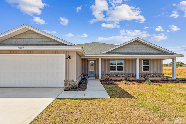 ranch-style home with a garage, covered porch, and a front yard