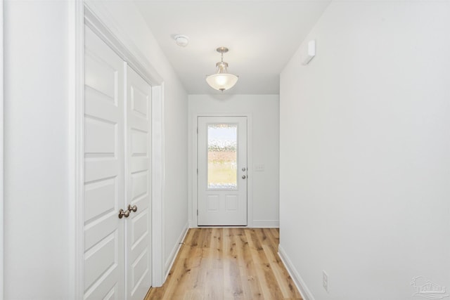 doorway to outside with light hardwood / wood-style flooring