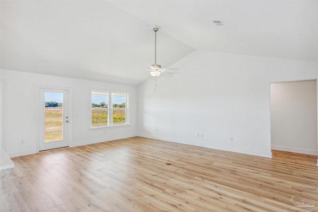 unfurnished living room featuring ceiling fan, lofted ceiling, and light wood-type flooring